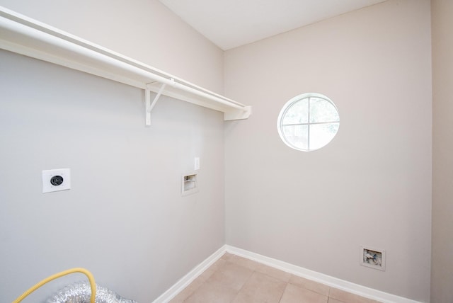 laundry area featuring washer hookup, light tile patterned floors, and electric dryer hookup