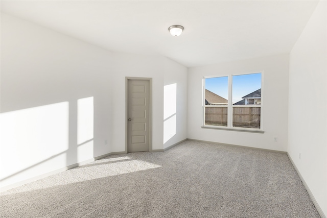 unfurnished room with carpet floors