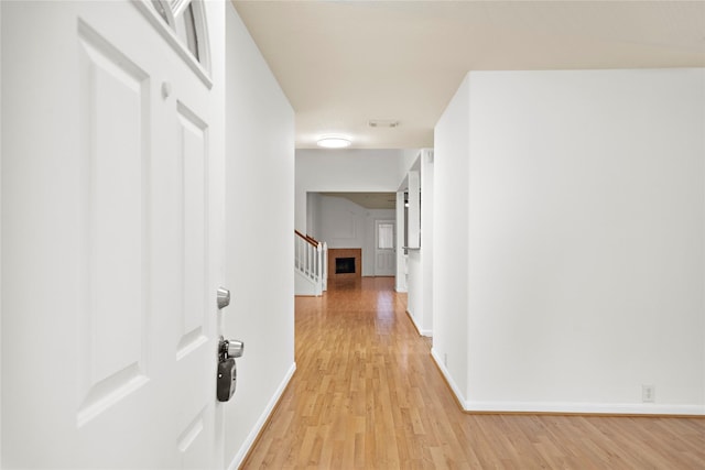 hall with light wood-type flooring