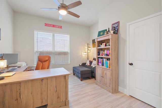 office with ceiling fan and light hardwood / wood-style floors