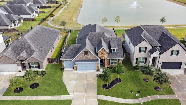 birds eye view of property featuring a water view