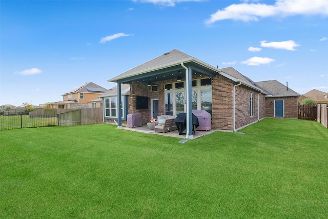 rear view of house with a lawn, ceiling fan, a patio, and an outdoor hangout area