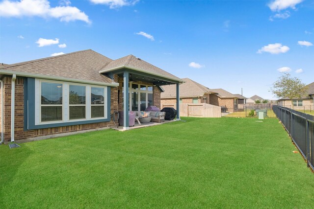 back of property featuring a patio area and a yard