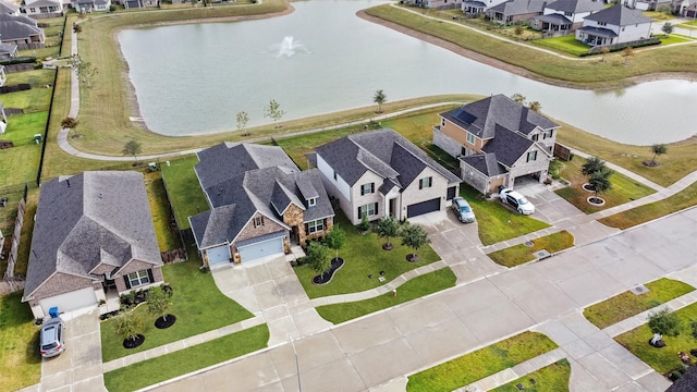 drone / aerial view featuring a water view