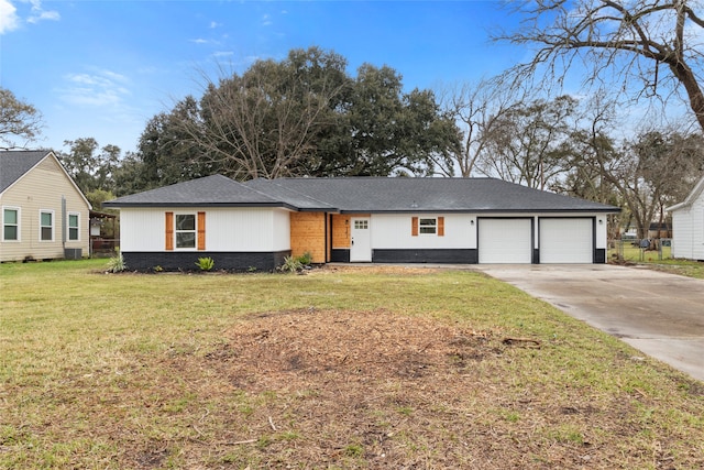 ranch-style home with a front yard and a garage