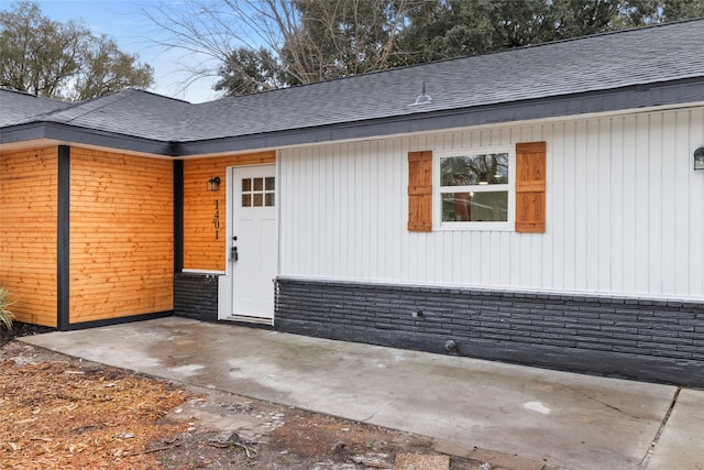 doorway to property with a patio area