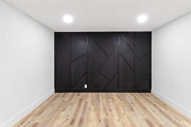 unfurnished room with light wood-type flooring