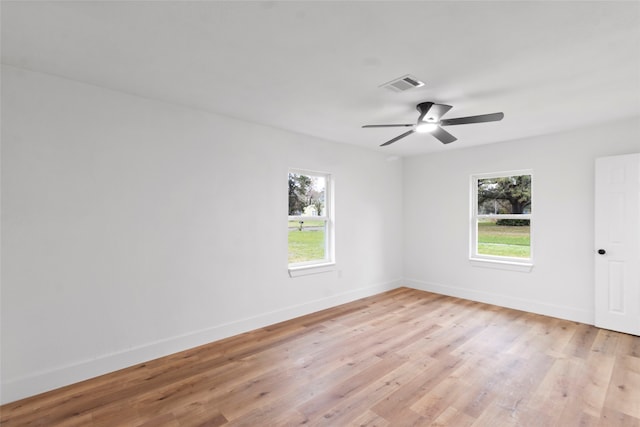 unfurnished room featuring ceiling fan and light wood-type flooring