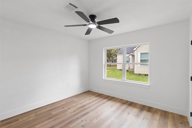 spare room featuring light hardwood / wood-style flooring and ceiling fan