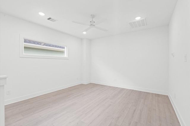 unfurnished room with ceiling fan and light wood-type flooring