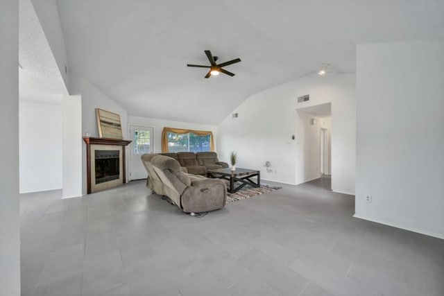 living room with ceiling fan and vaulted ceiling