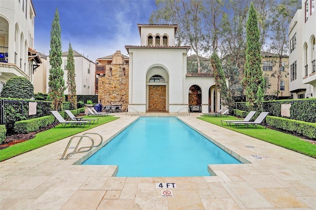 view of swimming pool with a patio area