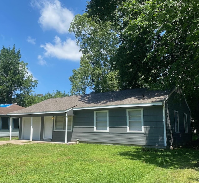 exterior space with a front lawn and covered porch