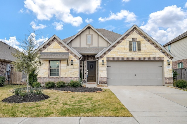 view of front of house featuring a garage and a front yard