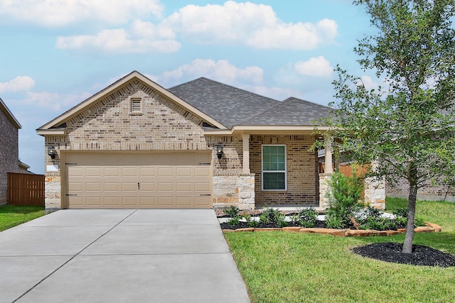 view of front facade with a front yard and a garage