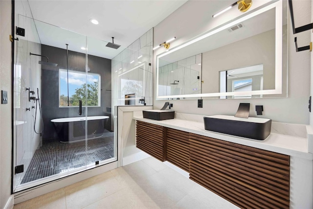 bathroom featuring tile patterned flooring, vanity, and separate shower and tub