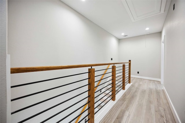 corridor with light hardwood / wood-style flooring