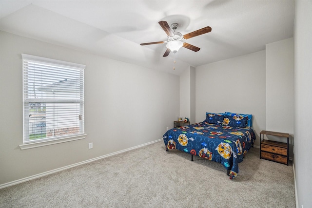 bedroom featuring ceiling fan and light carpet