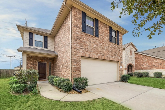 view of front of home with a front yard and a garage