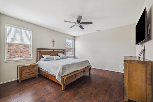 bedroom featuring ceiling fan and dark hardwood / wood-style floors