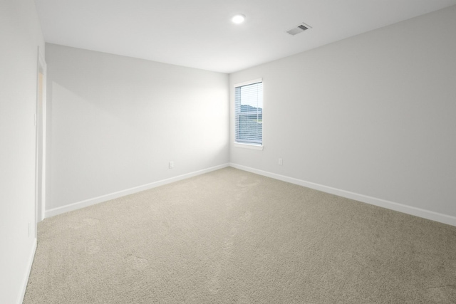 unfurnished room with carpet flooring