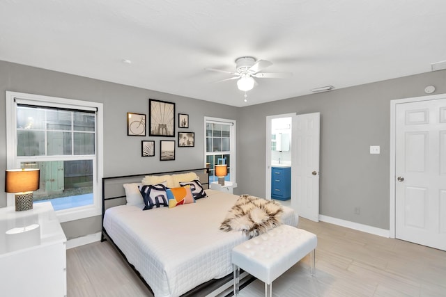 bedroom featuring ensuite bathroom and ceiling fan