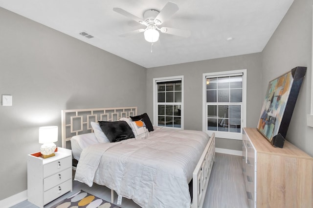 bedroom featuring light wood-type flooring and ceiling fan