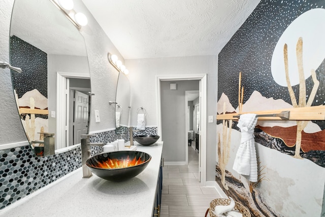 bathroom featuring vanity and a textured ceiling