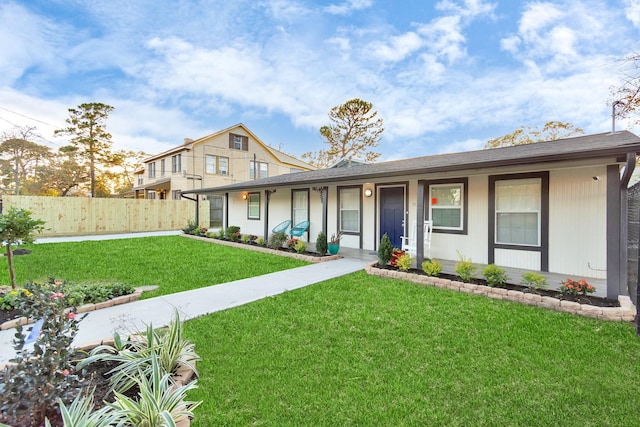 view of front of home featuring covered porch and a front lawn