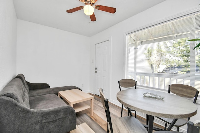 interior space with ceiling fan and light wood-type flooring