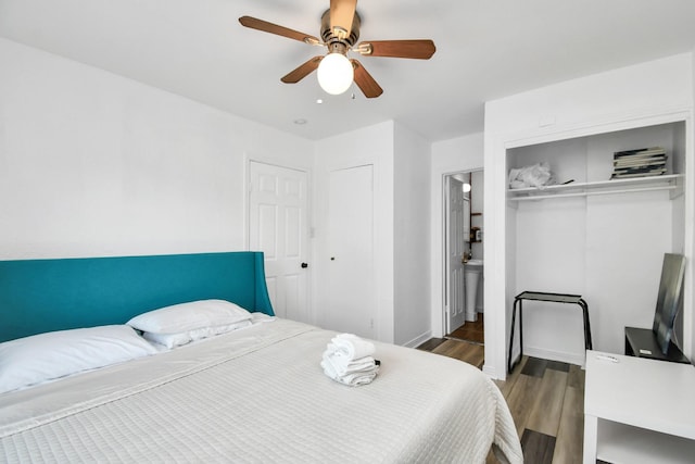 bedroom featuring ceiling fan and dark hardwood / wood-style flooring