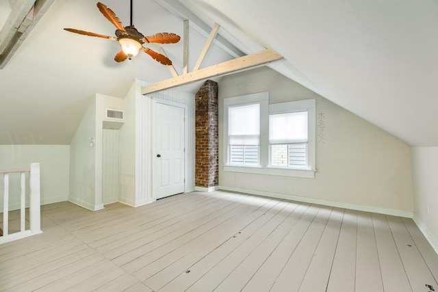 bonus room with light hardwood / wood-style flooring, lofted ceiling with beams, and ceiling fan