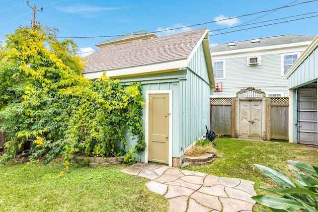 view of outbuilding with a lawn