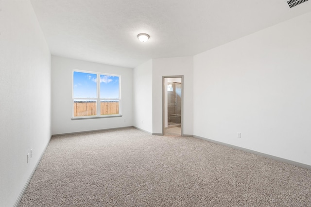 unfurnished room featuring carpet