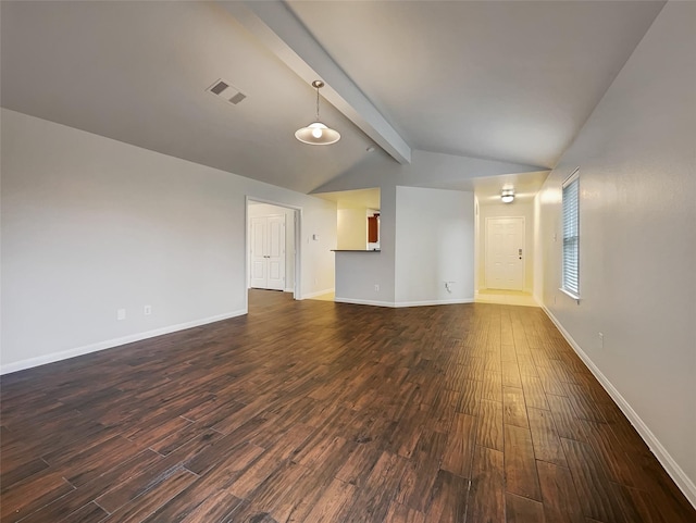 unfurnished living room featuring dark wood-type flooring and lofted ceiling with beams