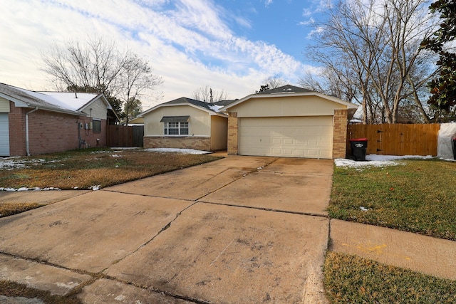 single story home with a garage and a front yard