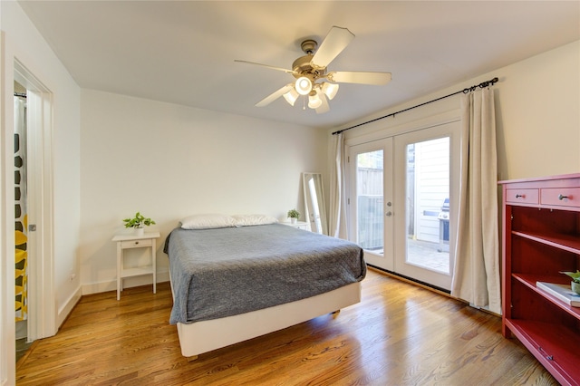 bedroom featuring ceiling fan, french doors, light hardwood / wood-style flooring, and access to exterior