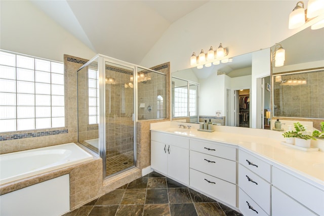 bathroom with vaulted ceiling, plus walk in shower, and vanity