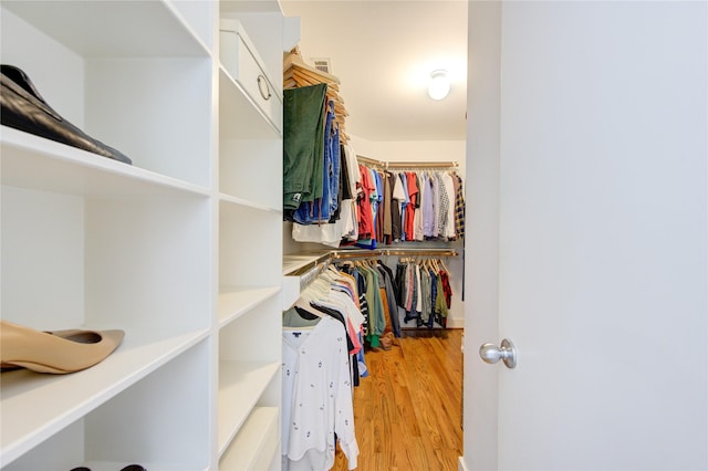 spacious closet featuring light hardwood / wood-style floors