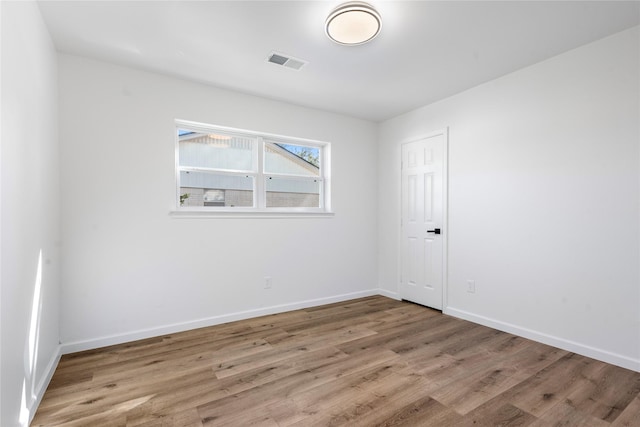 spare room with light hardwood / wood-style floors