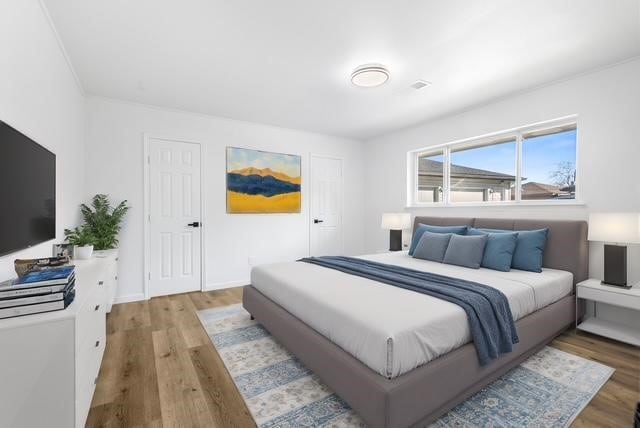 bedroom featuring wood-type flooring