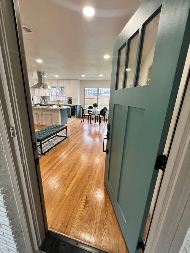 hallway with light hardwood / wood-style flooring