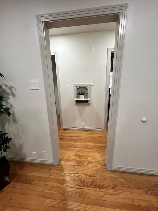 hall with light hardwood / wood-style flooring