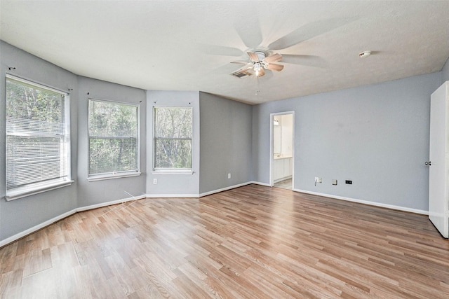 unfurnished room with light hardwood / wood-style flooring and ceiling fan