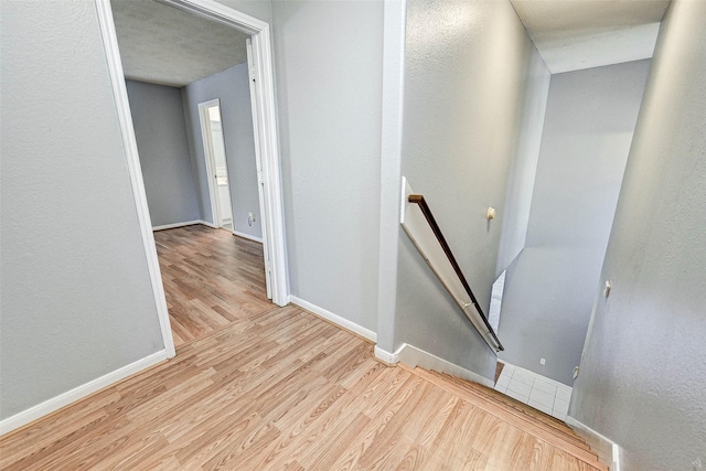 stairway featuring hardwood / wood-style flooring