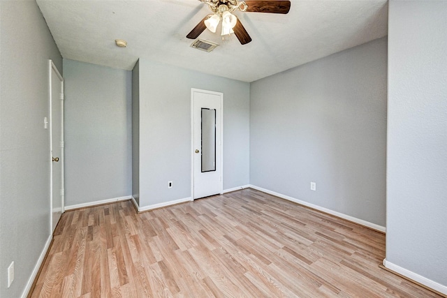 unfurnished bedroom featuring ceiling fan and light wood-type flooring