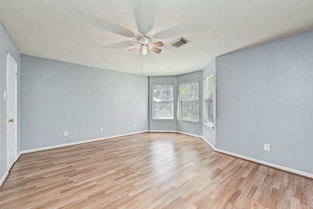 spare room with ceiling fan and light hardwood / wood-style floors