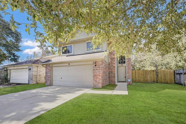 view of front of home with a garage and a front lawn