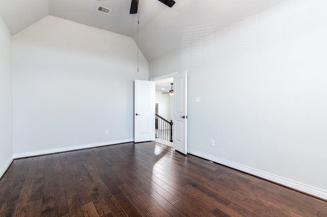 spare room with lofted ceiling, ceiling fan, and dark hardwood / wood-style floors