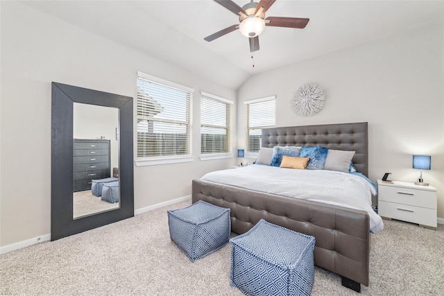 carpeted bedroom featuring ceiling fan and vaulted ceiling